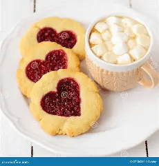 Heart-shaped jam cookies with marshmallow hot chocolate